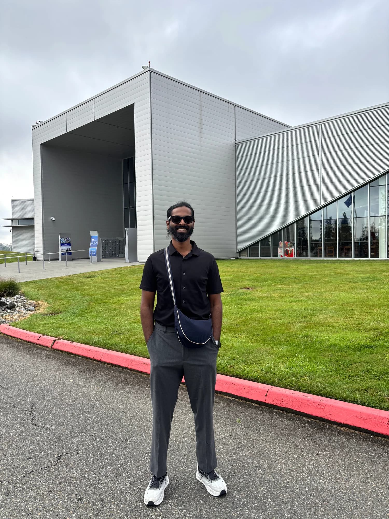 Rohith Ejjaparapu outside a modern industrial building